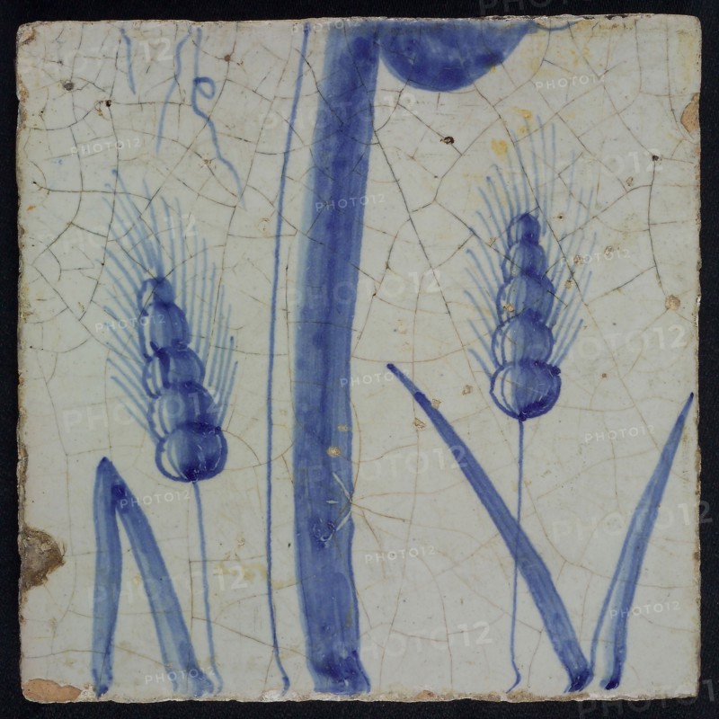 Blue tile with ears of corn and stem, of chimney pilaster with 13 tiles, tree of bunches of grapes with birds, bird of prey