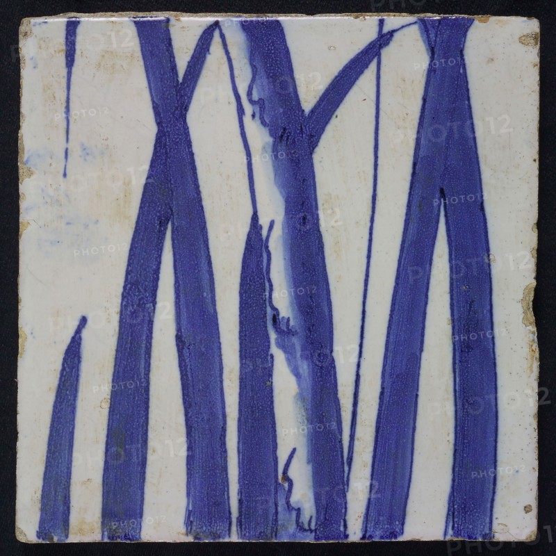 Blue tile with petioles of chimney pilaster with 13 tiles, tree of bunches of grapes with birds, with bird of prey, spider