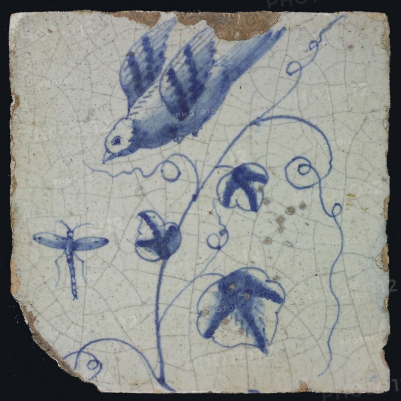 Blue tile with bird in flight to flying dragonfly, grape leaves, chimney pilaster with 13 tiles, tree of bunches of grapes