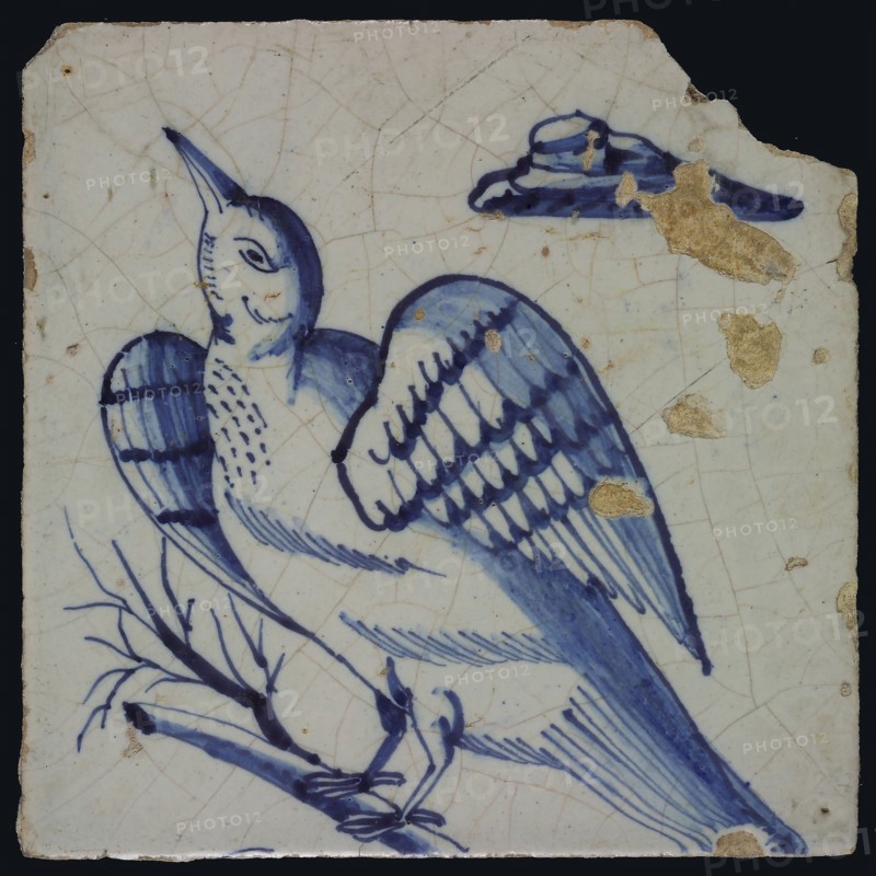 Blue tile with bird looking up at left on barren branch, cloud top right, possible part of pilaster, tile pilaster footage