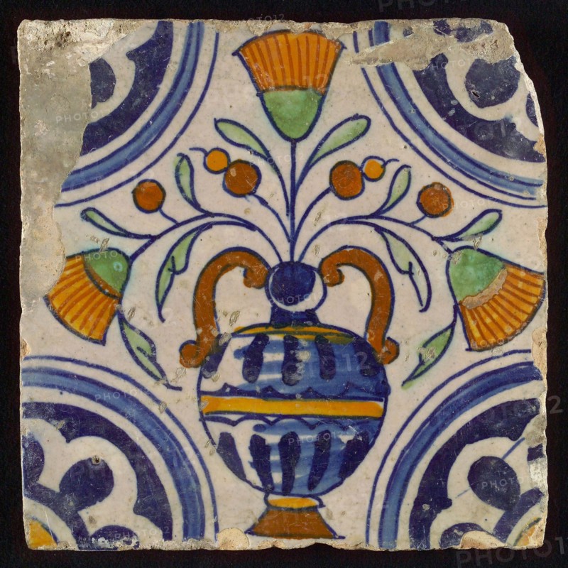 Tile, blue draft, orange, brown and green on white, central flowerpot with marigolds, corner pattern, rosette, wall tile