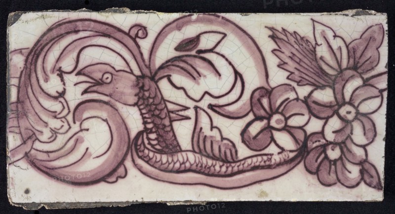 Rectangular edge tile in purple with sling of leaves, flowers and twisted snake with scales and fin, edge tile wall tile tile