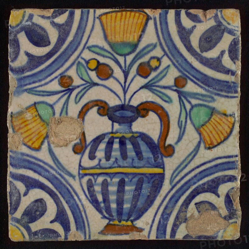 Tile, blue draft, orange, brown, yellow and green on white, central flowerpot with marigolds, corner pattern, rosette, wall tile