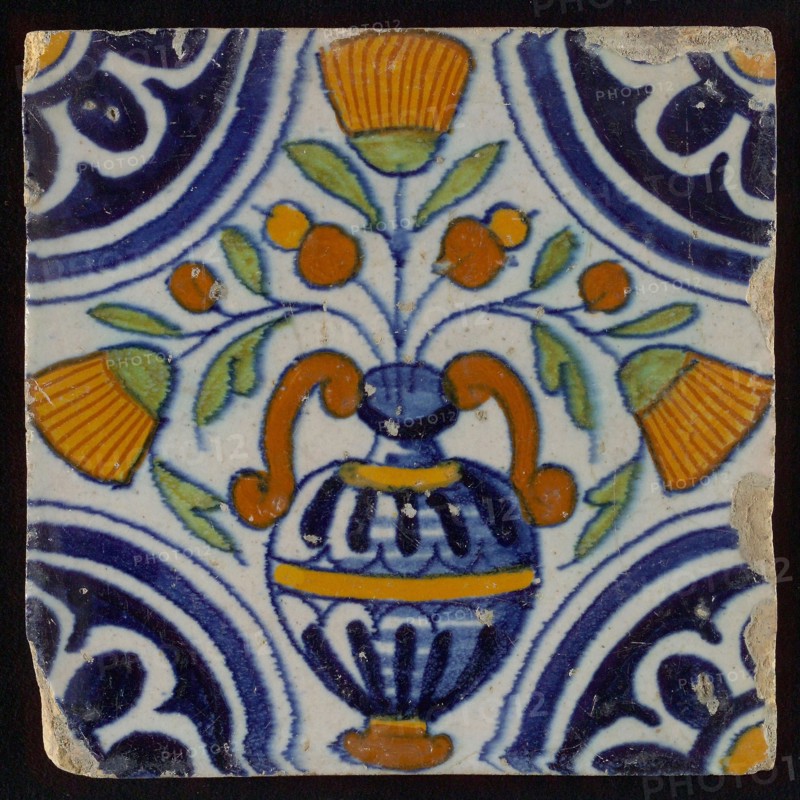 Tile, blue draft, orange, brown and green on white, central flowerpot with marigolds, corner pattern, rosette, wall tile