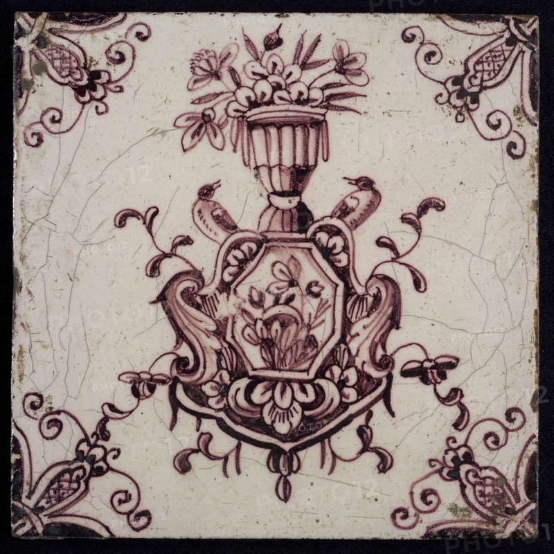 tile manufacturer: Aalmis, Cartouche tile, vase with flowers, and singing birds, corner motif spider, wall tile tile sculpture