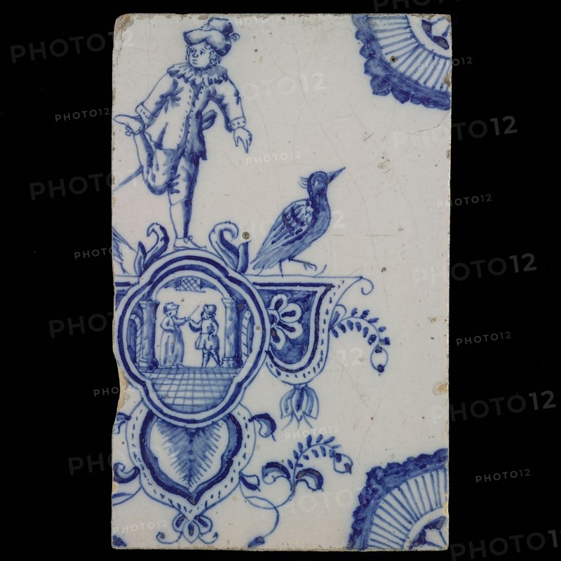 tile manufacturer: Aalmis, Cartouche tile, acrobat with man and woman, corner motif quarter rosette, wall tile tile sculpture