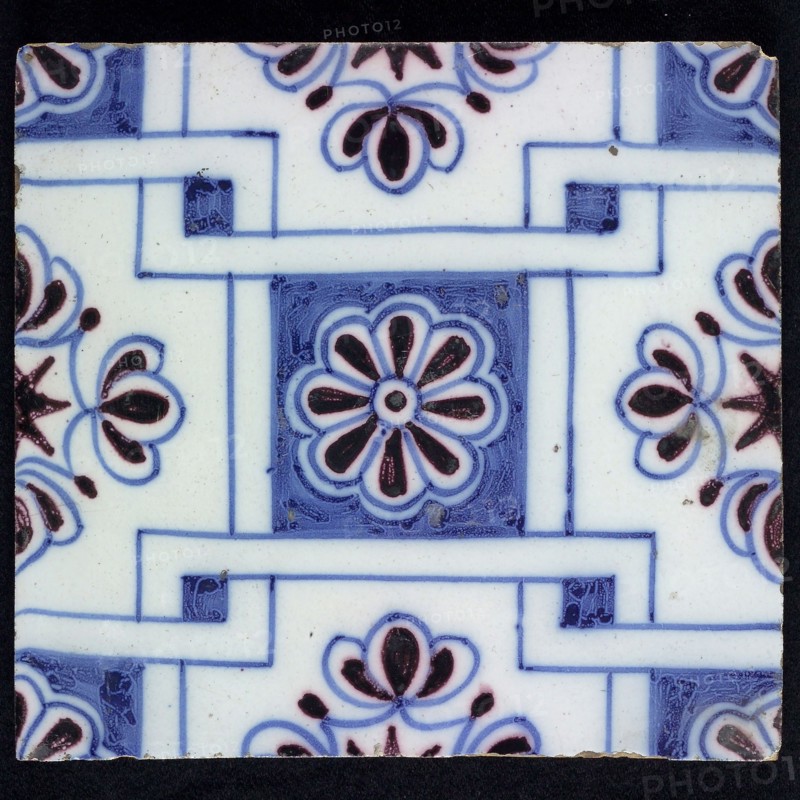 Ornament tile, blue on white, central square decor with purple rosette, along two blue diagonals diamond pattern, with flowers