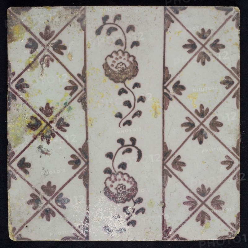 Ornament tile, purple on white, vertical decor with two flowers in the middle lane, diamond pattern with quarter flower motif