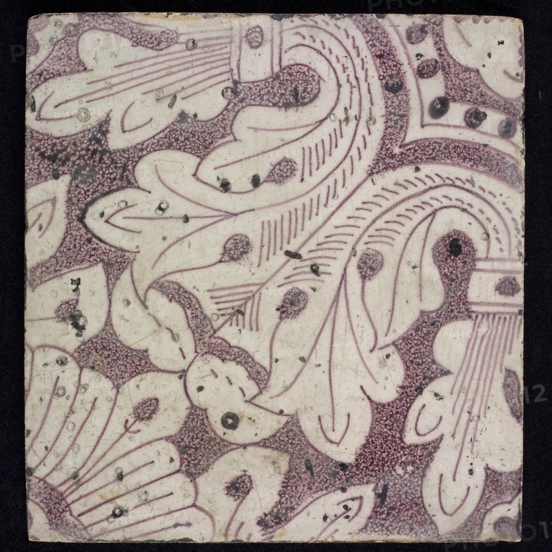 Sprinkled purple ornament tile, acanthus leaf rising from corner with quarter flower surrounded by octagonal pattern with pearls