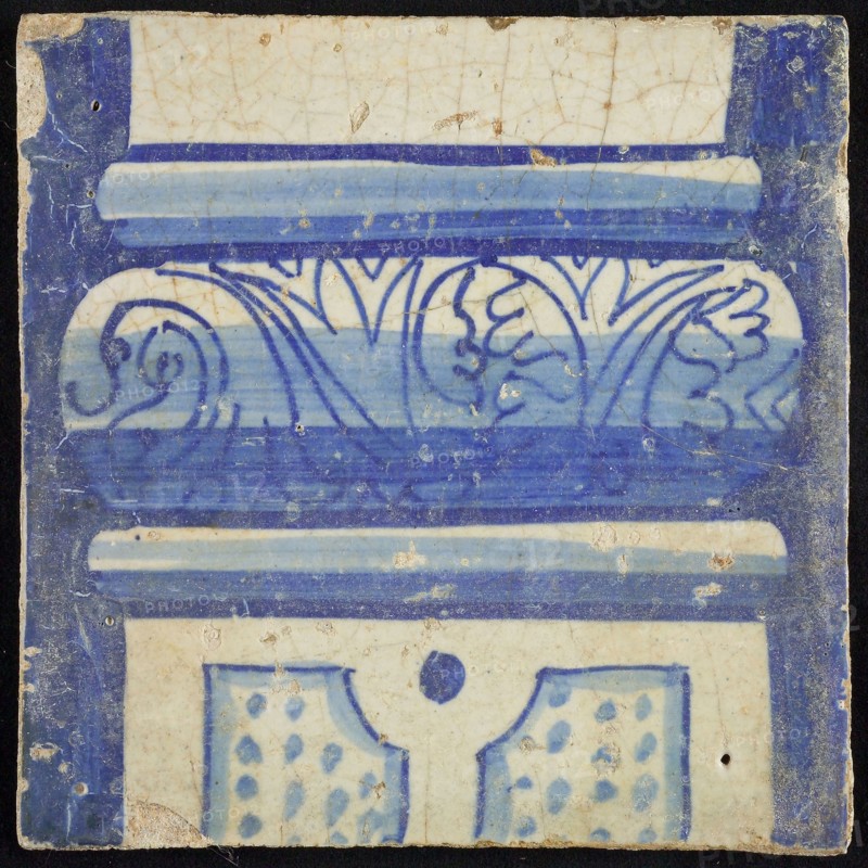 Tile of chimney pilaster, blue on white, part of pillar with basement with floral decoration, division with dots, chimney