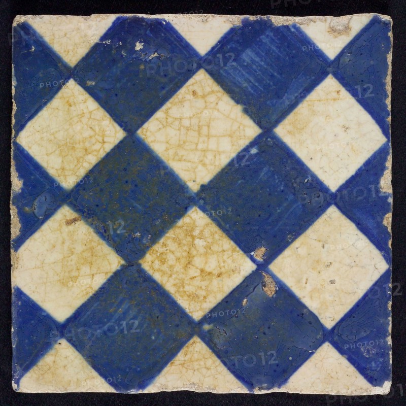 Ornament tile, checkerplate motif, small windows, floor tile tile sculpture ceramic earthenware glaze, Blue on white with dark