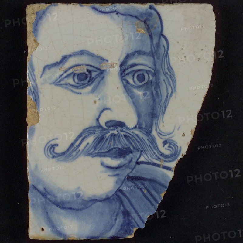 Tile with blue portrait of man with mustache, Gaius Mucius Scaevola, tile picture footage fragment ceramic earthenware glaze