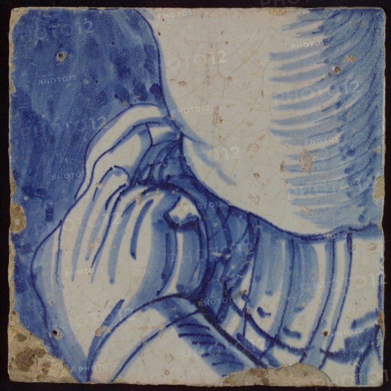 Tile with blue drawing (part of body with arm?), tile picture footage fragment ceramics pottery glaze, d 1.1