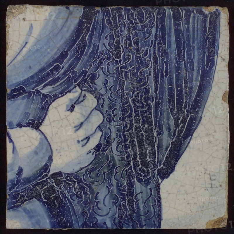 Tile with blue hand on pleated clothing, tile picture footage fragment ceramics pottery glaze, Love