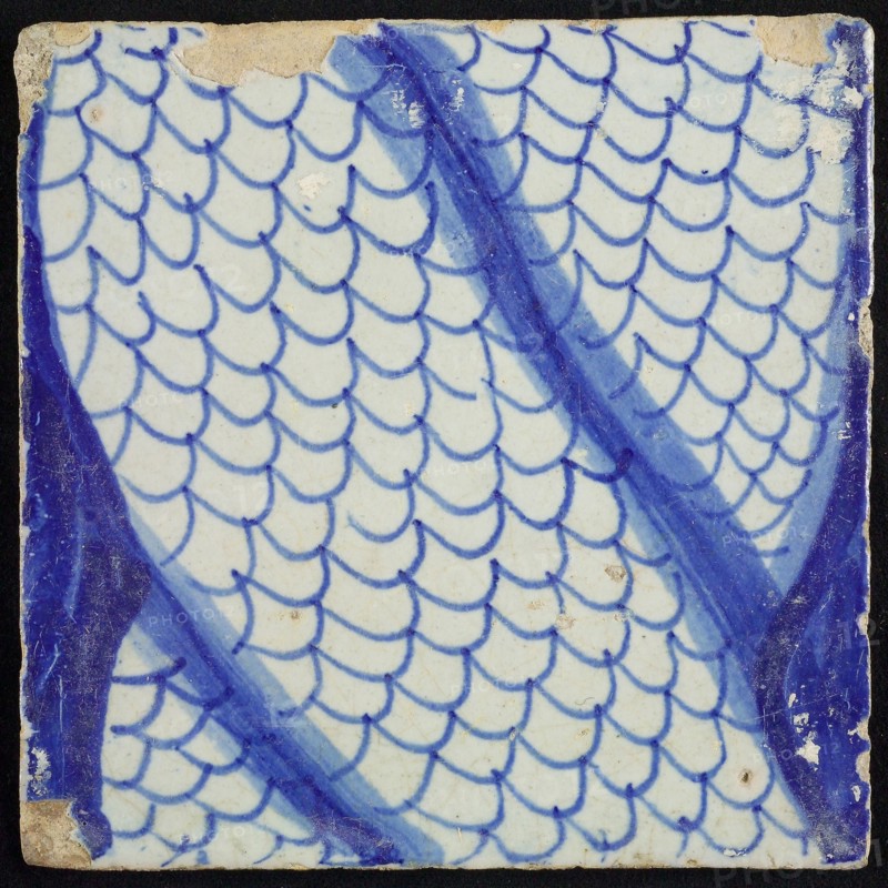 Tile of chimney pilaster, blue on white, part of column, middle part of winding scaly tails, chimney pilaster tile pilaster