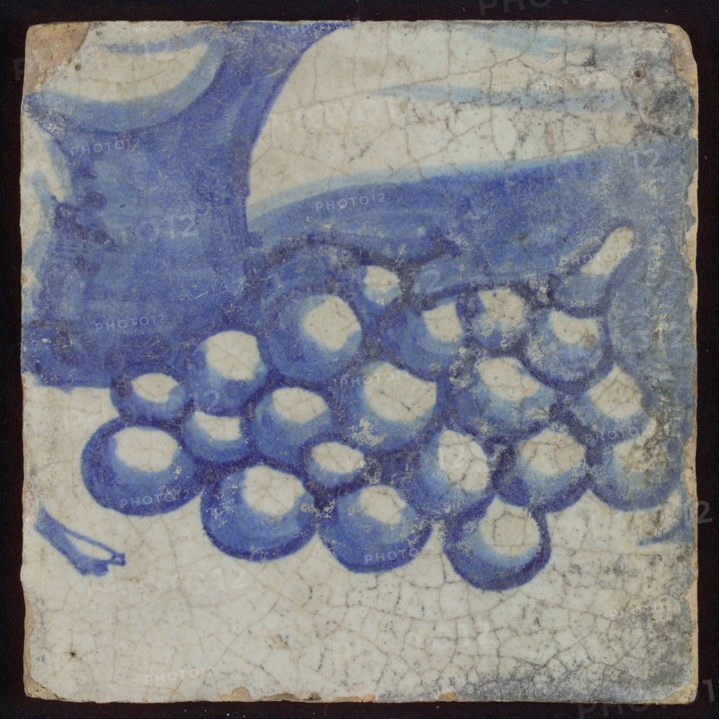 Tile with grapes in blue bunch, tile picture footage fragment ceramics pottery glaze, d 1.0