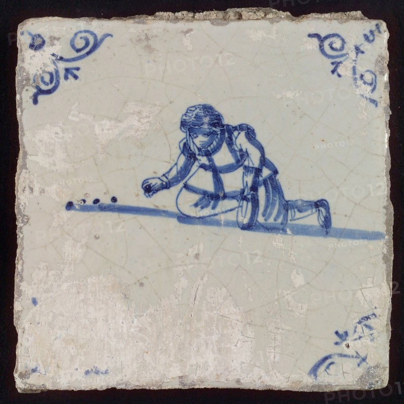 Scene tile, child's play, marbles, corner motif ox's head, wall tile tile sculpture ceramic earthenware glaze, baked 2x glazed