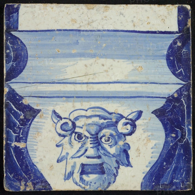 Tile of chimney pilaster, blue on white, part of column with basement with baluster on which head of horned figure, chimney