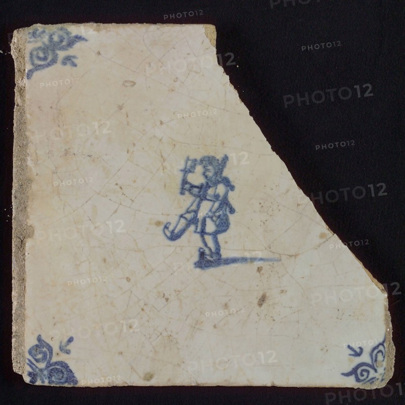 Scene tile, boy in narrepak, corner motif ox's head, wall tile tile sculpture ceramic earthenware enamel, baked 2x glazed