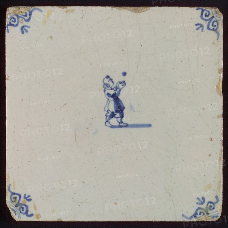 Scene tile, child's play, child with ball, corner motif ox's head, wall tile tile sculpture ceramic earthenware glaze, baked 2x