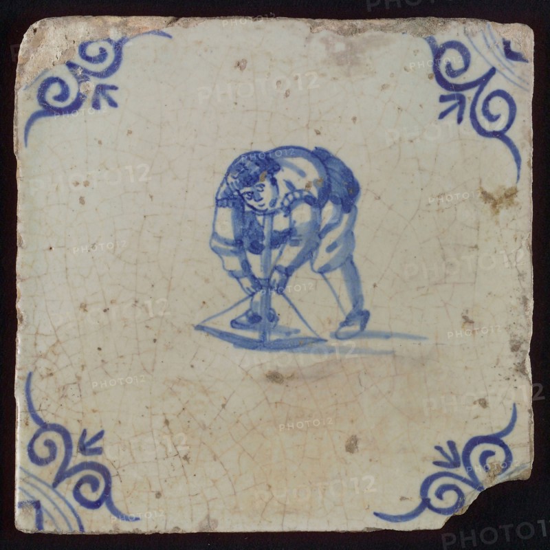 Scene tile, child's play, child with crossbow, corner pattern ox's head, wall tile tile sculpture ceramic earthenware glaze