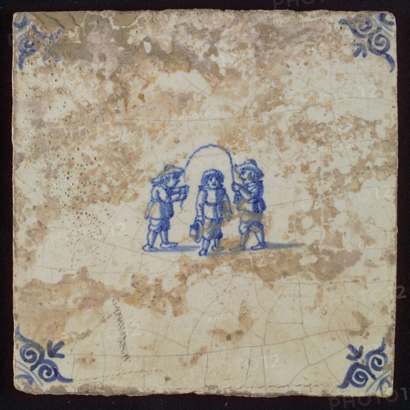 Scene tile, child's play, jump rope, corner motif ox's head, wall tile tile sculpture ceramic earthenware glaze, baked 2x glazed