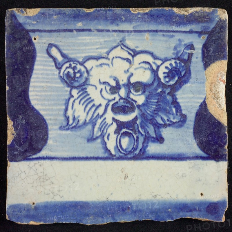 Tile of chimney pilaster, blue on white, part of column with base on which horned lion's head with ring, chimney pilaster tile