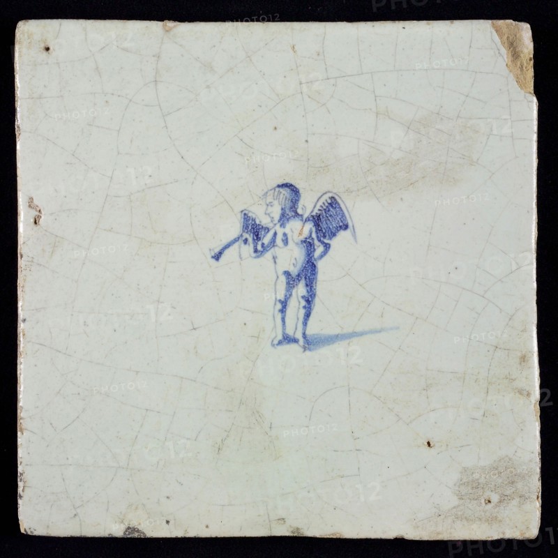 White tile with blue putto with horn, wall tile tile sculpture ceramic earthenware glaze, baked 2x glazed painted
