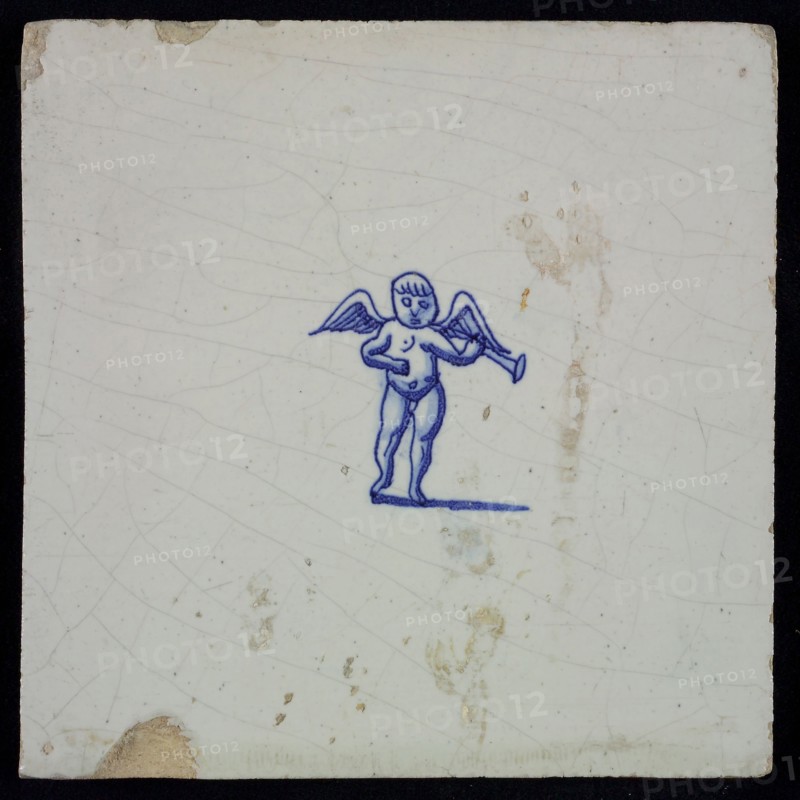White tile with blue putto with wind instrument, wall tile tile sculpture ceramics pottery glaze, baked 2x glazed painted music