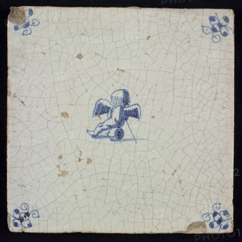 White tile with blue seated putto; corner motif spider, wall tile tile sculpture ceramic earthenware glaze, baked 2x glazed