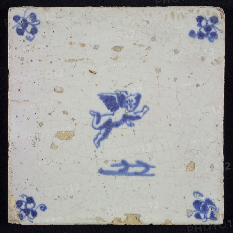 White tile with blue flying putto; corner motif spider, wall tile tile sculpture ceramic earthenware glaze, baked 2x glazed