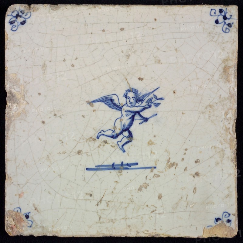 White tile with blue flying putto; corner motif spider, wall tile tile sculpture ceramic earthenware glaze, baked 2x glazed