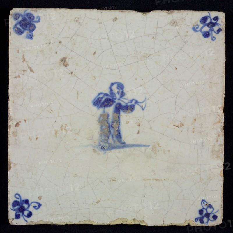 White tile with blue putto with wind instrument; corner motif spider, wall tile tile sculpture ceramics pottery glaze, baked 2x