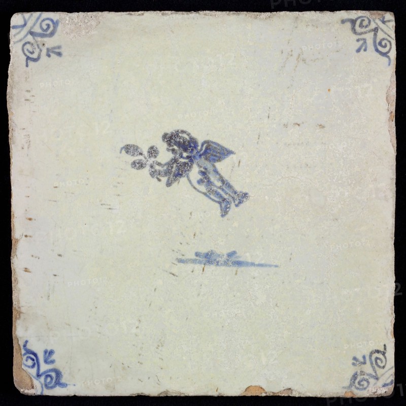 White tile with blue flying putto; corner pattern ox head, wall tile tile sculpture ceramic earthenware glaze, baked 2x glazed