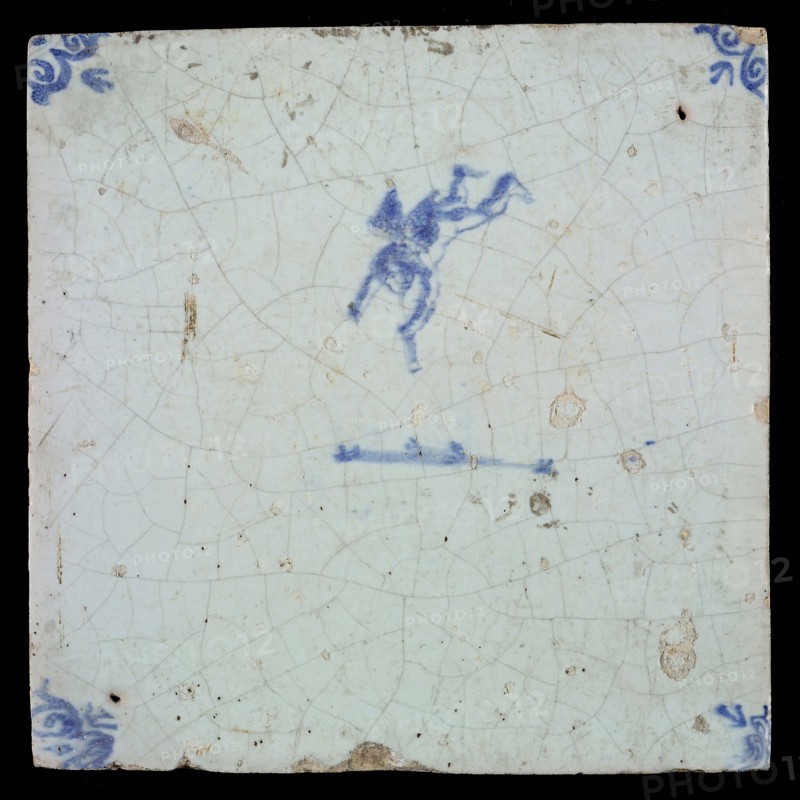 White tile with blue flying putto with wind instrument; corner pattern ox head, wall tile tile sculpture ceramic earthenware