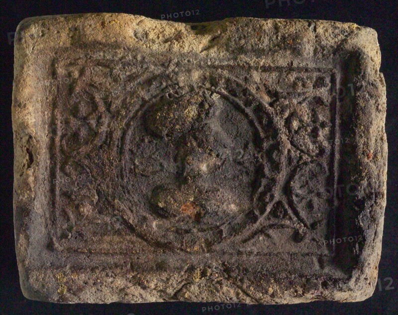 Hearthstone, Luiks, from Luik, Liege Belgium, with wide frame, with male head, natural stone fireplace component ceramic brick