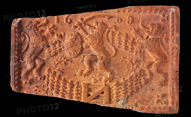 Hearthstone, from Antwerp Belgium, with narrow frame, with lion in Dutch garden, fireplace stone part ceramics brick, baked