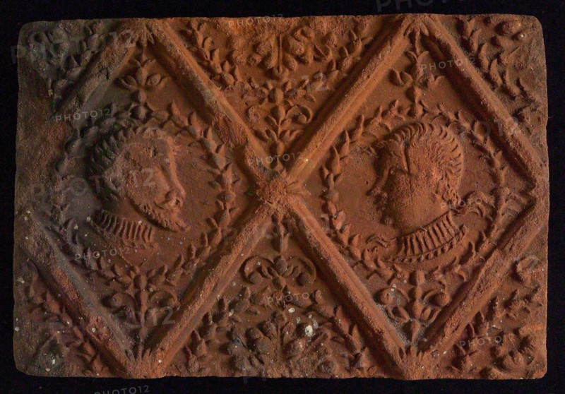 Hearthstone, from Antwerp Belgium, without frame, with male and female head, natural stone fireplace component ceramic brick