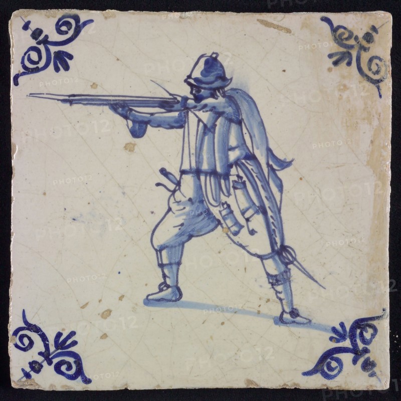 White tile with blue warrior; corner pattern ox head, wall tile tile sculpture ceramics pottery glaze, baked 2x glazed painted