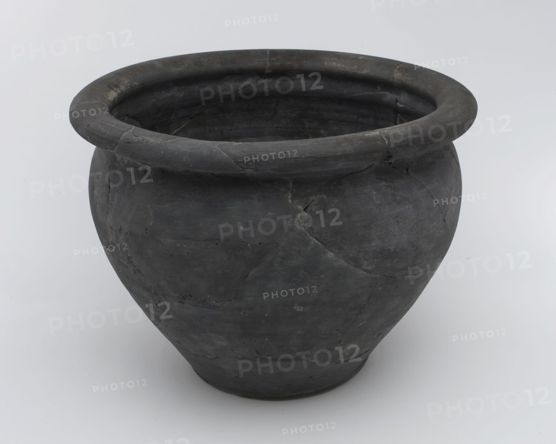 Black storage jar on standing surface, folded upper edge above constriction, storage jar pot holder soil find ceramic