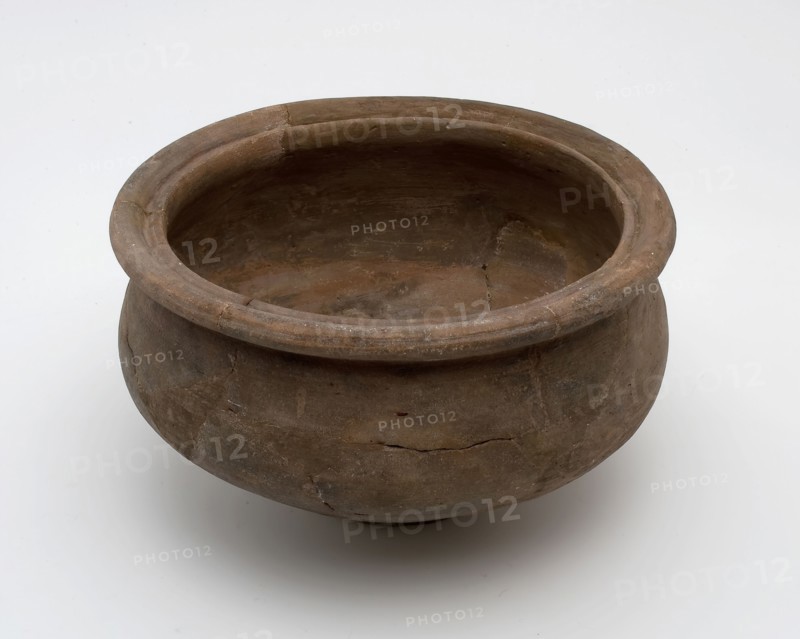 Small brown pot on narrow stand, baluster shape with grooved top edge, Roman pottery, pot holder soil find ceramic pottery, hand