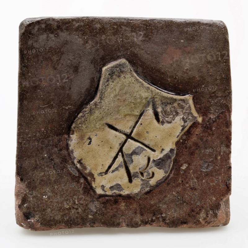 Tile, brown glazed with yellow shield with mark, tiling floor tile tile footage soil find ceramic earthenware glaze lead glaze