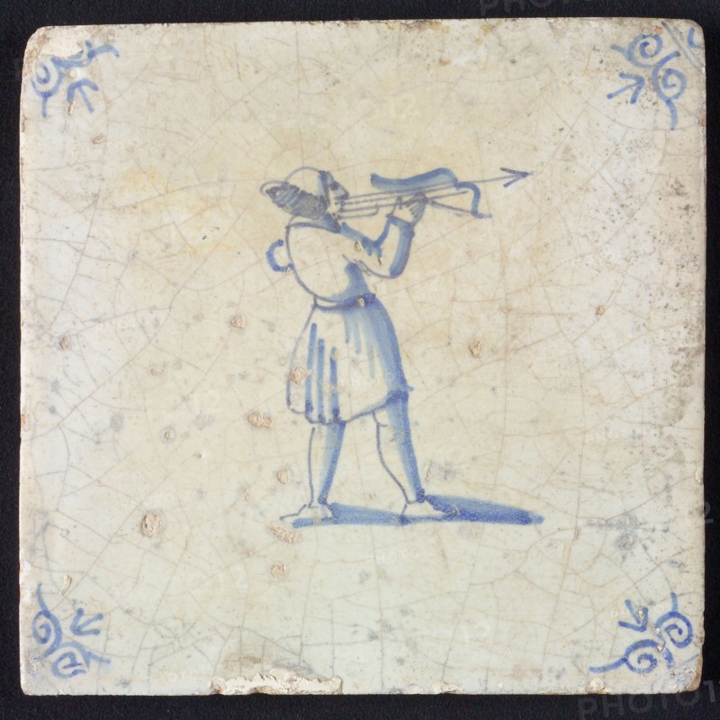 White tile with blue warrior with bow and arrow; corner pattern ox head, wall tile tile sculpture ceramic earthenware glaze