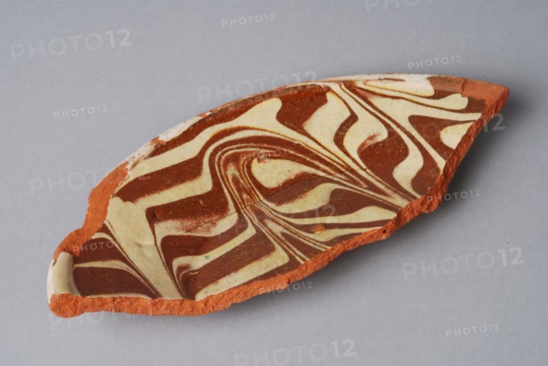 Fragment of earthenware plate with decor in sludge flow technique, plate crockery holder fragment earthenware ceramics