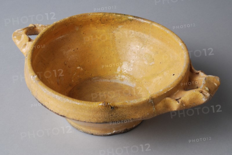 Yellow pap bowl on stand with two pinched, lobed ears, porcelain crockery holder soil find ceramic earthenware glaze lead glaze