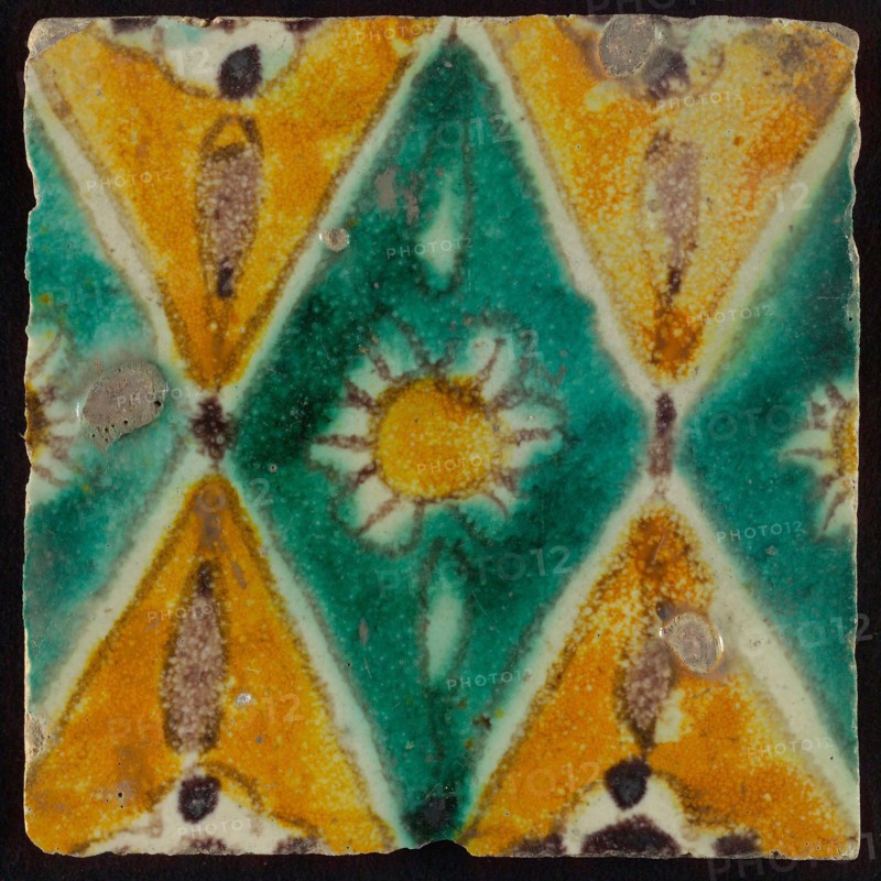 Floor tile, brown draft, green and yellow on white ground, central green oblique glass in which white flower with yellow heart