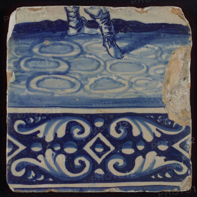 Tile of tableau with in blue feet and decorated border, tile picture footage fragment ceramic pottery glaze, baked 2x glazed