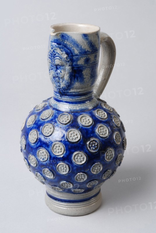 Stoneware jug with ear, belly with imposed rosettes, neck with mask, jug crockery holder ceramic stoneware glaze salt glaze