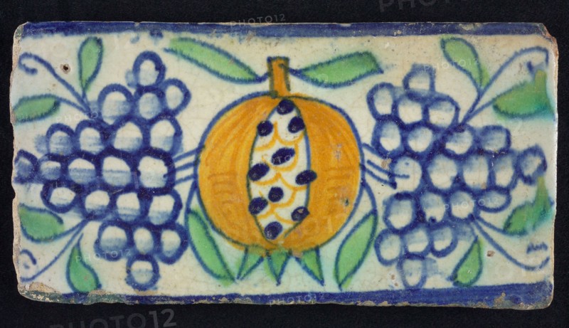Border tile, with pomegranate, bunches of grapes and leaves, edge tile wall tile tile sculpture ceramic earthenware glaze, baked