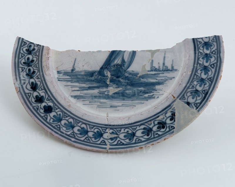 Blue-and-white faience plate on stand, flat flag, decor with rigged sailing ship, plate crockery holder fragment earthenware